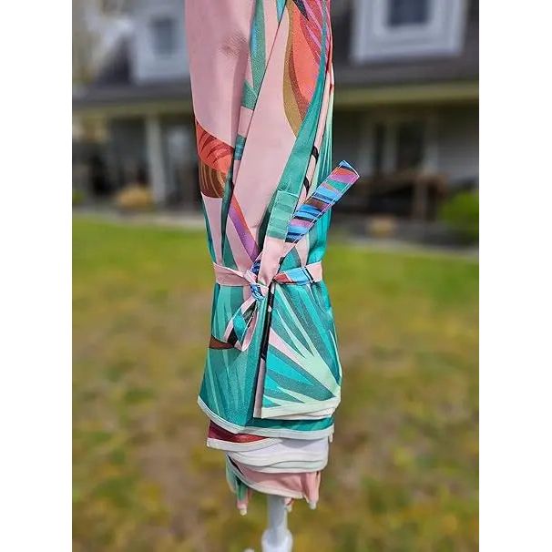 Pink parasol with tropical leaves UV protection UPF 40+ beach umbrella Ø 155